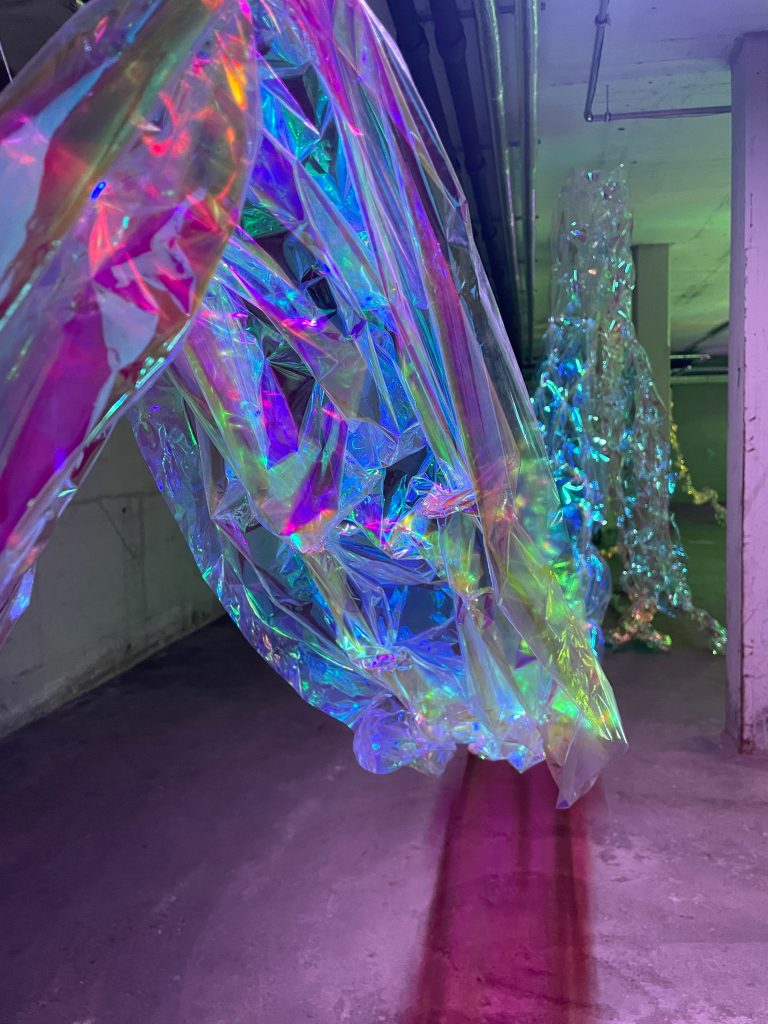 'waterfall' of magic multicoloured foil, art installation, Eindhoven